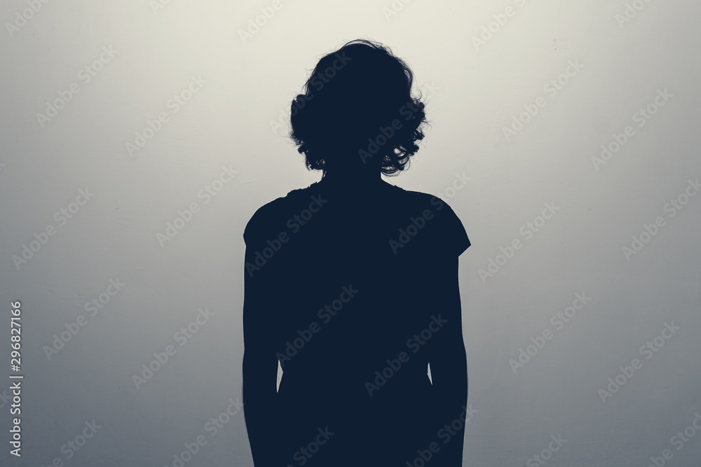 Unknown female person silhouette in studio. Concept of depression, stress or anonymous - obrazy, fototapety, plakaty 