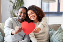 Love, Valentines Day And Relationships Concept - Happy African American Couple Holding Red Heart Together At Home
