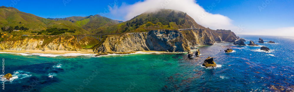 Arial view of the California Bixby bridge in Big Sur in the Monterey County along side State Route 1 US, the ocean road.  - obrazy, fototapety, plakaty 