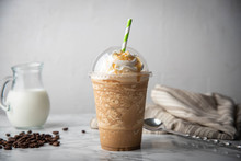 Caramel Frappuccino With Wipped Cream On Marble Table