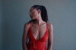 © Adam Perez - Studio shot of stylish young woman in red dress