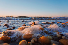 Eye Level View Of Stones And Sea Foam