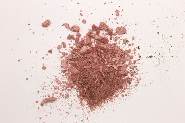 This is a photograph of a Pearly Pink powder eyeshadow isolated on a White background