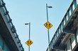Yellow directional signs at crossroads