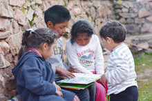 Native American Kids Reading A  Book.