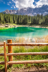 Wall Mural - turquoise mountain lake carezza in dolomites, italy