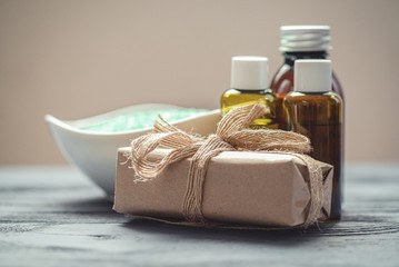 Bath salt, craft soap and aromatherapy oil bottles on the table. Hygiene concept.