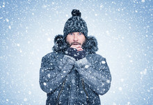 Frozen Bearded Man In Winter Clothes Warms His Hands, Cold, Snow, Frost, Blizzard 