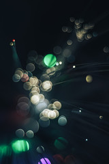 Poster - Beautiful abstract fiber optical network cable on a multi colored glow background.