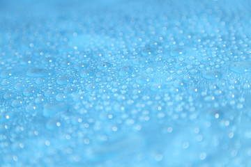 Close up water drops on blue background, Water drop in macro photography