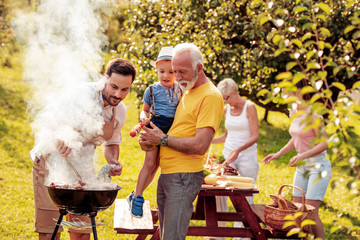 Wall Mural - Family make barbecue together