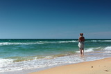 Fototapeta Konie - summer seascape girl on a beautiful beach