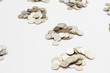 © epovdima - coins divided in piles on a white background