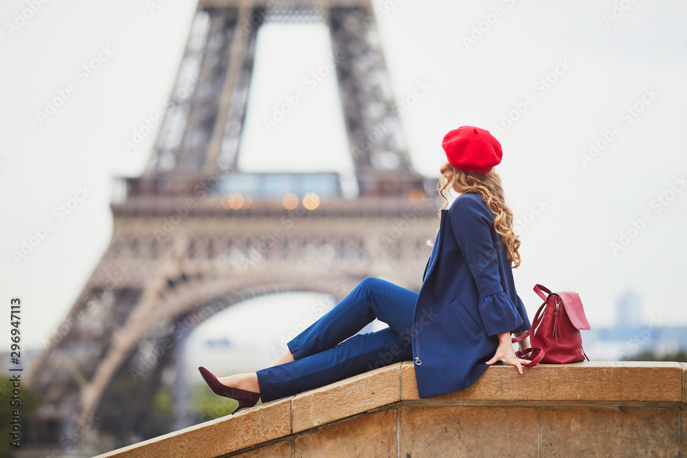 Young woman with long blond curly hair in Paris, France - obrazy, fototapety, plakaty 