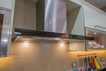 Modern kitchen cooker hood in a luxury apartment