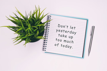 Wall Mural - Don't let yesterday take up too much of today - Inspiration quotes on note pad.