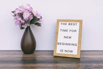 Wall Mural - The Best time for new beginning is now - Inspiration quotes on wooden frame.