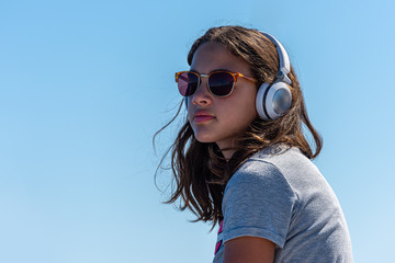 cute girl with sunglasses and headphone