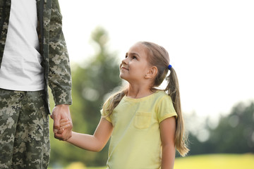 Poster - Little girl with her father in military uniform at sunny park