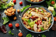 Caesar Salad Pasta with chicken, tomato, parmesan cheese and vegetables
