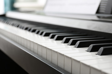 Poster - Modern piano with music sheets in room, closeup