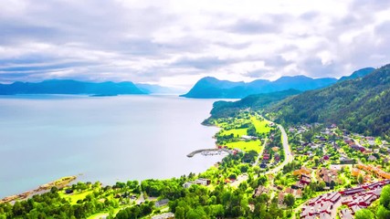 Poster - Molde, Norway. Aerial view of residential area in Molde, Norway during the sunny day in summer. Beautiful fjord with mountains in summer, time-lapse, zoom in