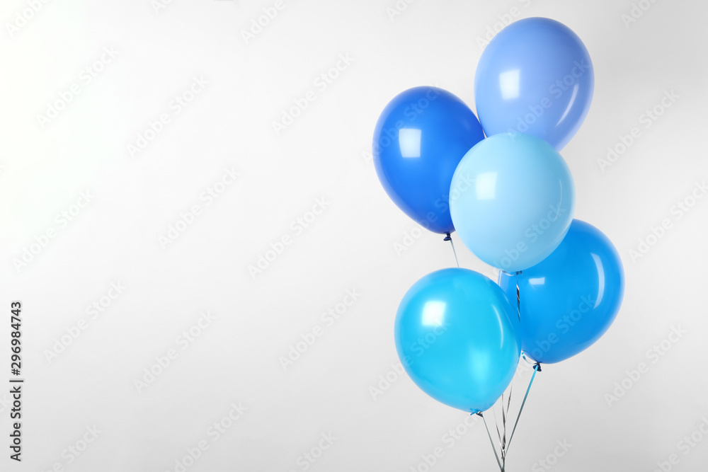 Bunch of blue balloons on white background. Greeting card - obrazy, fototapety, plakaty 