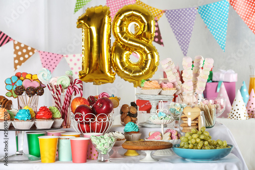 Dessert table in room decorated with golden balloons for 18 year birthday party Poster Mural XXL