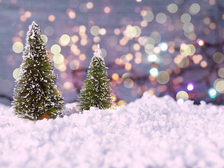christmas card with two green trees on background. tow toy christmas trees on red background as chri