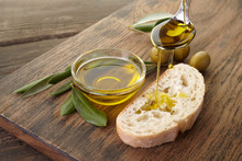 Slice Of Bread Seasoned With Olive Oil On Wooden Background