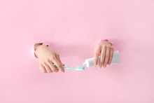 Female Hands With Toothbrush And Paste On Color Background