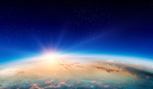 Earth With Sunrise On Blue Space Background