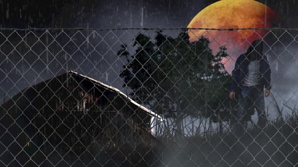 Canvas Print - halloween barn with orange moon and zombie 4k loop features an old barn in a field behind a chain li