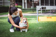 © Peera - Asian woman with Welsh Corgi Pembroke dog