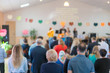 © jollier_ - Children on stage perform in front of parents. Parents watch children's performances. Children's holiday