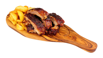 Wall Mural - Grilled mini pork ribs and French fries on a wooden serving board isolated on a white background