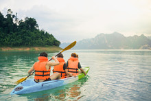 Family Kayaking In In Ratchaprapha Dam At Khao Sok National Park, Surat Thani Province, Thailand.