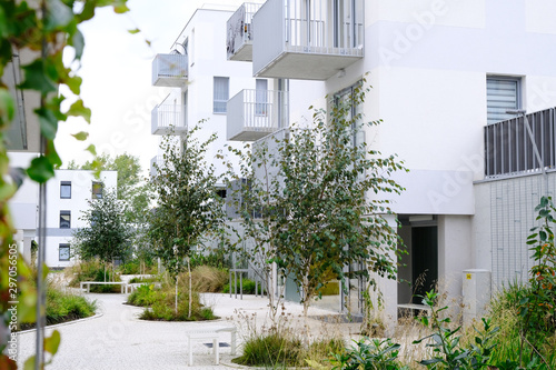 Fotomural Sidewalk in a cozy courtyard of modern apartment buildings condo with white walls