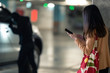 © torwaiphoto - Woman is calling the police. The thief was leverage her car at the parking lot at night.