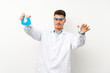 © luismolinero - Young scientific holding laboratory flask over isolated background
