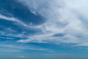 Wall Mural - A big, white cloud on the blue sky