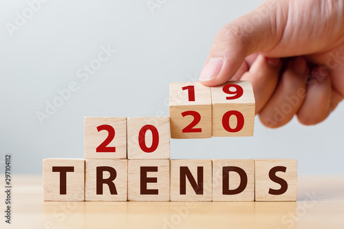 Cuadros en Lienzo 2020 trend concept. Hand flip wood cube change year 2019 to 2020