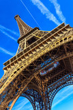 Fototapeta Paryż - Paris Eiffel Tower in Paris, France. Eiffel Tower is one of the most iconic landmarks in Paris. Architecture and landmarks of Paris.