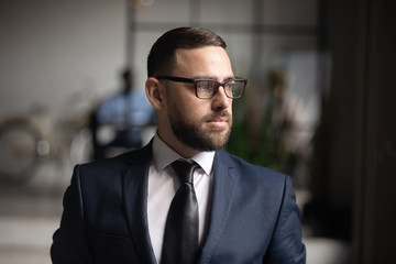 Wall Mural - Serious thoughtful businessman wear suit looking away thinking of future