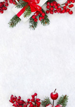 Christmas Decoration, Banner. Gift Box With Red Ribbon, Bow, Twigs Christmas Tree, Red Berries And Apples On Snow With Space For Text. Top View, Flat Lay