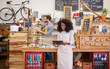 © marvent - Young African American barista using a tablet in her cafe