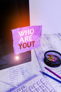 Word writing text Who Are Youquestion. Business photo showcasing someone asking your demonstratingal background or history Note paper taped to black computer screen near keyboard and stationary