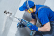 © Kadmy - boring hole for electric outlet by power tool drill.