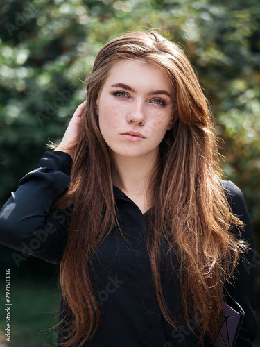 Closeup Portrait Of Young Natural Beautiful Redhead Woman In Black