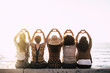 © simona - Group of happy people  outdoor friends women viewed from back doing love hearth sign with up hands - concept of relationship - sunset and sea in background